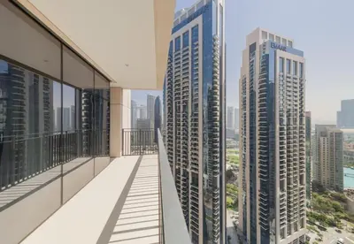 a balcony with views of buildings in the city at Luxury 3BR Downtown Stay Near Burj in Dubai