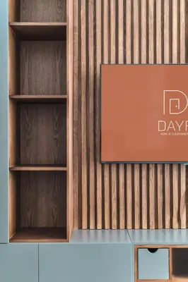 a wall with wooden shelves and a sign on it at DAYF-SER03 Brand New Studio with Balcony in JVC in Dubai