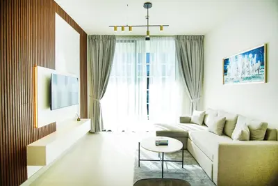 a living room with a couch and a table at 1bhk brand new in JVC Binghatti Lavender in Dubai
