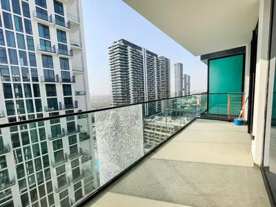 an apartment balcony with a view of a city at 1bhk brand new in JVC Binghatti Lavender in Dubai