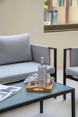 a bottle of water sitting on a coffee table at Frank Porter - Groove at Creek Beach in Dubai