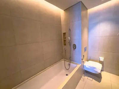 a bathroom with a tub and a sink at ADDRESS BEACH RESORT Residence Million Dollar Sea and Palm View DXB AIRPORT VIP Shuttle option in Dubai