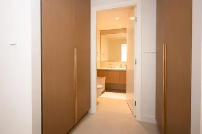 a bathroom with a toilet and a sink at Creek New Luxury Stay Beach and Lagoona Access in Dubai