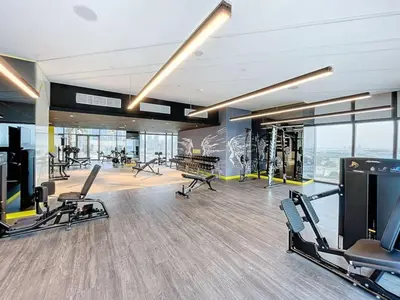 a gym with treadmills and exercise equipment in a building at Vacationer I Luxury 2 Bedroom Apartment I Business Bay, Near Dubai Canal I Aykon City Tower 2 in Dubai