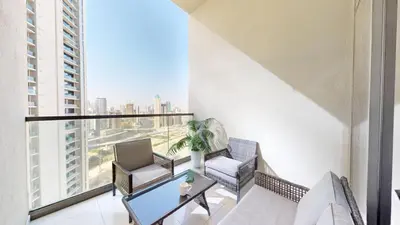 a balcony with two chairs and a glass table at Vacationer I Luxury 2 Bedroom Apartment I Business Bay, Near Dubai Canal I Aykon City Tower 2 in Dubai