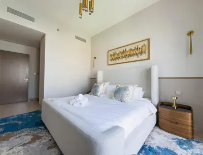 a bedroom with a large white bed in a room at GRANDE SIGNATURE with a direct Burj Khalifa view and Private Fountain Show at high floor with DXB AIRPORT VIP Shuttle option for 8 guests in Dubai