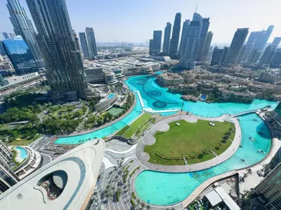 an aerial view of a city with tall buildings at GRANDE SIGNATURE with a direct Burj Khalifa view and Private Fountain Show at high floor with DXB AIRPORT VIP Shuttle option for 8 guests in Dubai