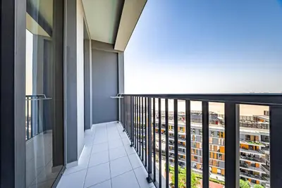 a balcony with a view of a building at Studio in Dubai Production City in Dubai