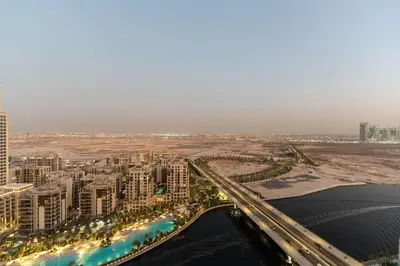 an aerial view of a city with a bridge at Creek palace residence by Hogar in Sabkhah