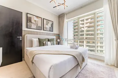 a bedroom with a large bed and a large window at 2BR with Marina View, Walking Distance to Marina Mall, Metro Station & JBR Beach, Al Majara 1, Dubai Marina by Deluxe Holiday Homes in Dubai