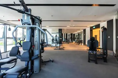 a gym with cardio equipment in a building at Skyline View 1BR, Minutes Away from Downtown and Dubai Mall, Nobles Tower, Business Bay by Deluxe Holiday Homes in Dubai