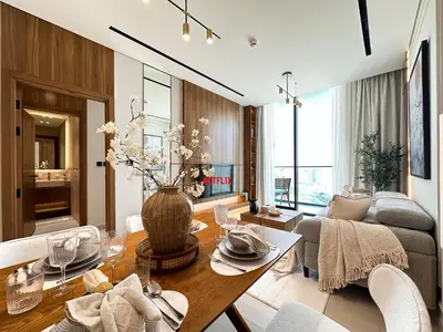 a living room with a table and a couch at Feel at Home Stylish 1BR in Binghatti Tulip Dubai in Dubai