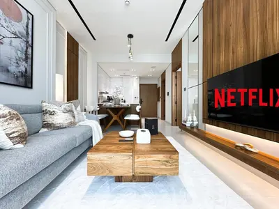 a living room with a couch and a coffee table at Feel at Home Stylish 1BR in Binghatti Tulip Dubai in Dubai