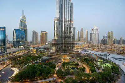 a view of a city with a tall skyscraper at Venetian - Signature 3BR with Burj Khalifa & Fountain views in Dubai