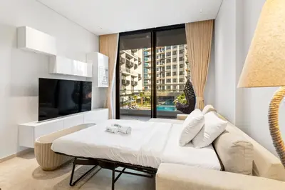 a bedroom with a bed and a large window at Chic Retreat 1Bedroom with Pool view in Dubai