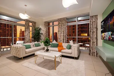 a living room with two couches and a table at Serene Cozy 2BR Near Burj Khalifa in Dubai