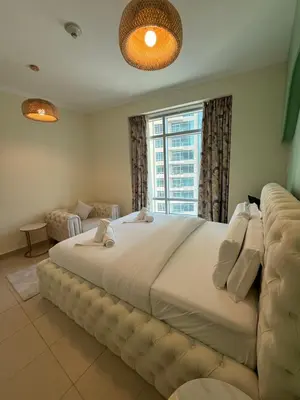 a large bed in a bedroom with a large window at Serene Cozy 2BR Near Burj Khalifa in Dubai