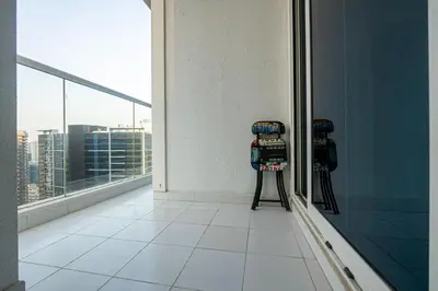 a room with two cameras on the side of a building at Venetian - Luxe Living 1 BR with Stunning Sky Line Views in Dubai