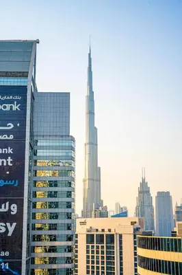 a view of a city skyline with a tall skyscraper at Venetian - Luxe Living 1 BR with Stunning Sky Line Views in Dubai