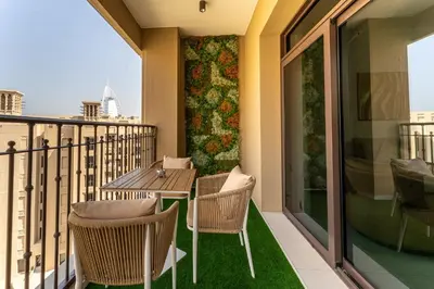 a balcony with a table and chairs on a balcony at HAVN - 1 Bedroom in Madinat Jumeirah Living in Dubai