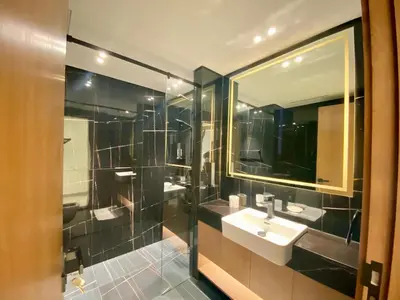 a bathroom with a sink and a mirror at Modern & Cozy 1 Bedroom Apartment in JVC 215-GLX-1 in Dubai