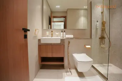 a bathroom with a toilet and a sink and a shower at Bnbeyond's Chic Urban Retreat with Upscale 1BR in Dubai