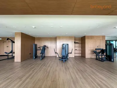 a gym with treadmills and ellipticals in a building at Bnbeyond's Chic Urban Retreat with Upscale 1BR in Dubai