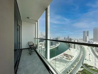 a balcony with a view of a city at Stylish 1-Bedroom-Sleeps 4- Apartment -Bayz by Danube, Business Bay-29 in Dubai