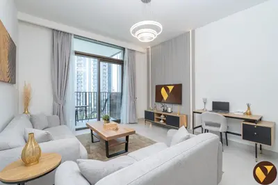 a living room with white furniture and a large window at Vogue Creek Harbour Creek Crescent Waterfront Living Close to Downtown, Burj Khalifa and Dubai Mall, One Bedroom Apartment with Balcony and City View, Access to all Amenities in Dubai