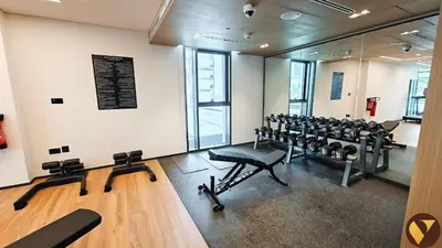 a gym with a row of chairs and a lot of equipment at Vogue Creek Harbour Creek Crescent Waterfront Living Close to Downtown, Burj Khalifa and Dubai Mall, One Bedroom Apartment with Balcony and City View, Access to all Amenities in Dubai