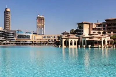 a large body of water in front of buildings at Cozy 2BDR Residence in Dubai's Souk Al Bahar in Dubai