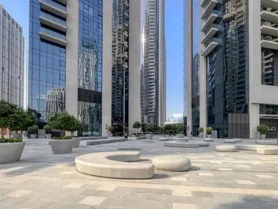 a courtyard in a city with tall buildings at The 34th Perch Downtown Retreat 2BDR in Dubai