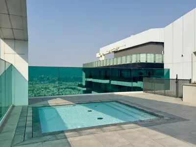 a swimming pool on the roof of a building at Luxury 2 BR Spectacular Downtown and Sea View next to metro in Dubai