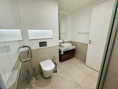 a bathroom with a toilet and a sink at Rahaal 1 BDR, Madinat Jumeirah in Dubai