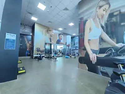 a woman on a treadmill in a gym at Luxury 4BHK in Business Bay w Burj Khalifa View Noora 4203 in Dubai
