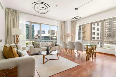 a living room with a couch and a table at Silkhaus Luxurious 1BDR in Downtown in Dubai