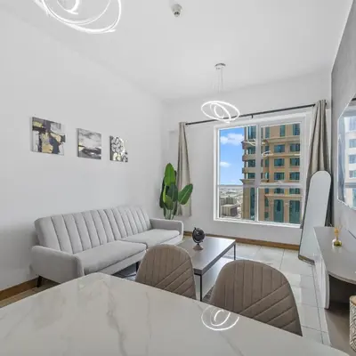 a living room with a couch and a table at 1BR in Sulafa Tower- Ideal for Short-Term Stay in Dubai
