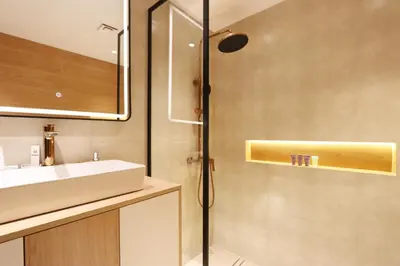 a bathroom with a sink and a shower at Stylish Studio with Spacious Balcony Walk to JBR Beach in Dubai