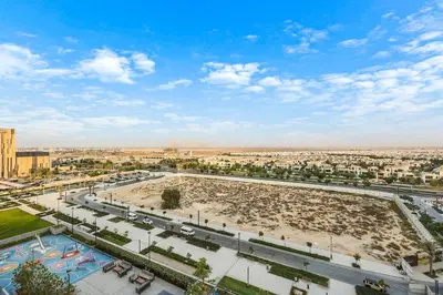 an aerial view of a large plaza in a city at Luxury 1BR Hills Green View Mall & Downtown Dining Shopping in Dubai
