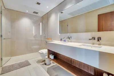 a bathroom with a sink and a shower and a toilet at DAYF-MGA Spacious 3Bed with Full Marina View in Dubai