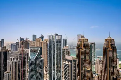 a view of a large city with tall buildings at DAYF-MGA Spacious 3Bed with Full Marina View in Dubai