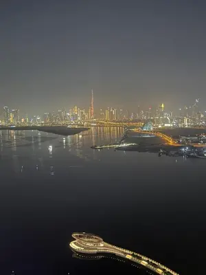 a bridge over the water with a city in the background at 3403!Dubai SkyLine View! Royal Montania Homes in Dubai