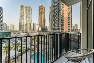 a balcony with a view of a city at Furnished 1BR, Walk to Business Bay Metro, Near Downtown, Ahad Residences, Business Bay by Deluxe Holiday Homes in Dubai