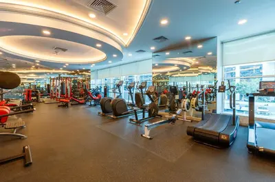 a gym with treadmills and cardio equipment in a building at Bright 1BR with Marina Views - Orra Marina - Allsopp & Allsopp in Dubai