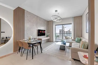 a living room with a table and a couch at Relaxing 1BR w Maids room Minutes to Dubai Mall by Vibel in Dubai