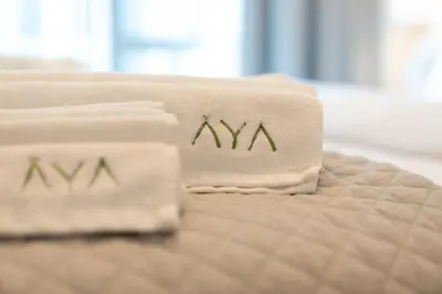 a close up of two towels on a bed at Luxurious 1BR Dubai Mall Burj Khalifa View pool in Dubai