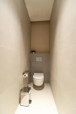 a small bathroom with a toilet in a room at Luxurious 1BR Dubai Mall Burj Khalifa View pool in Dubai
