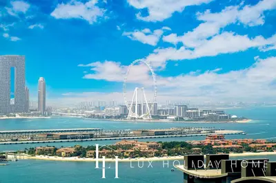 a view of a city with the arch in the water at LUX Iconic Views at The Palm Tower Studio 3 in Dubai