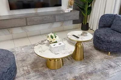 a living room with two chairs and a table at Durrani Homes - Zaafaran Luxe Stay Iconic Burj View in Dubai