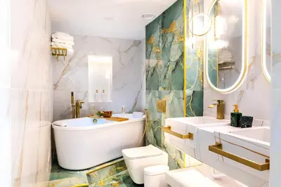 a bathroom with a tub and a toilet and a sink at FIRST CLASS Studio Downtown Bliss Urban Gem in Dubai